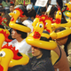 Demonstrators wear inflatable headdresses in the shape of chickens that symbolize the Chinese word for referendum, referring to a referendum on direct elections as more than 1,000 people held a rally and later marched in downtown Hong Kong on Sunday, Jan. 23, 2005, to demand full democracy and social justice in the Chinese territory. The protesters chanted, "Direct elections in 2007 and 2008," the years in which Hong Kong is due a to get new leader and legislature. This former British colony was handed over to Chinese rule in 1997 with a guarantee of democratic political rights that do not exist on the mainland, but many residents who want democracy say Beijing exerts too much control here